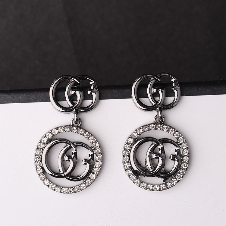 Replica Designer GUCCI Women Ancient G Gun Black Gold Diamond Earrings